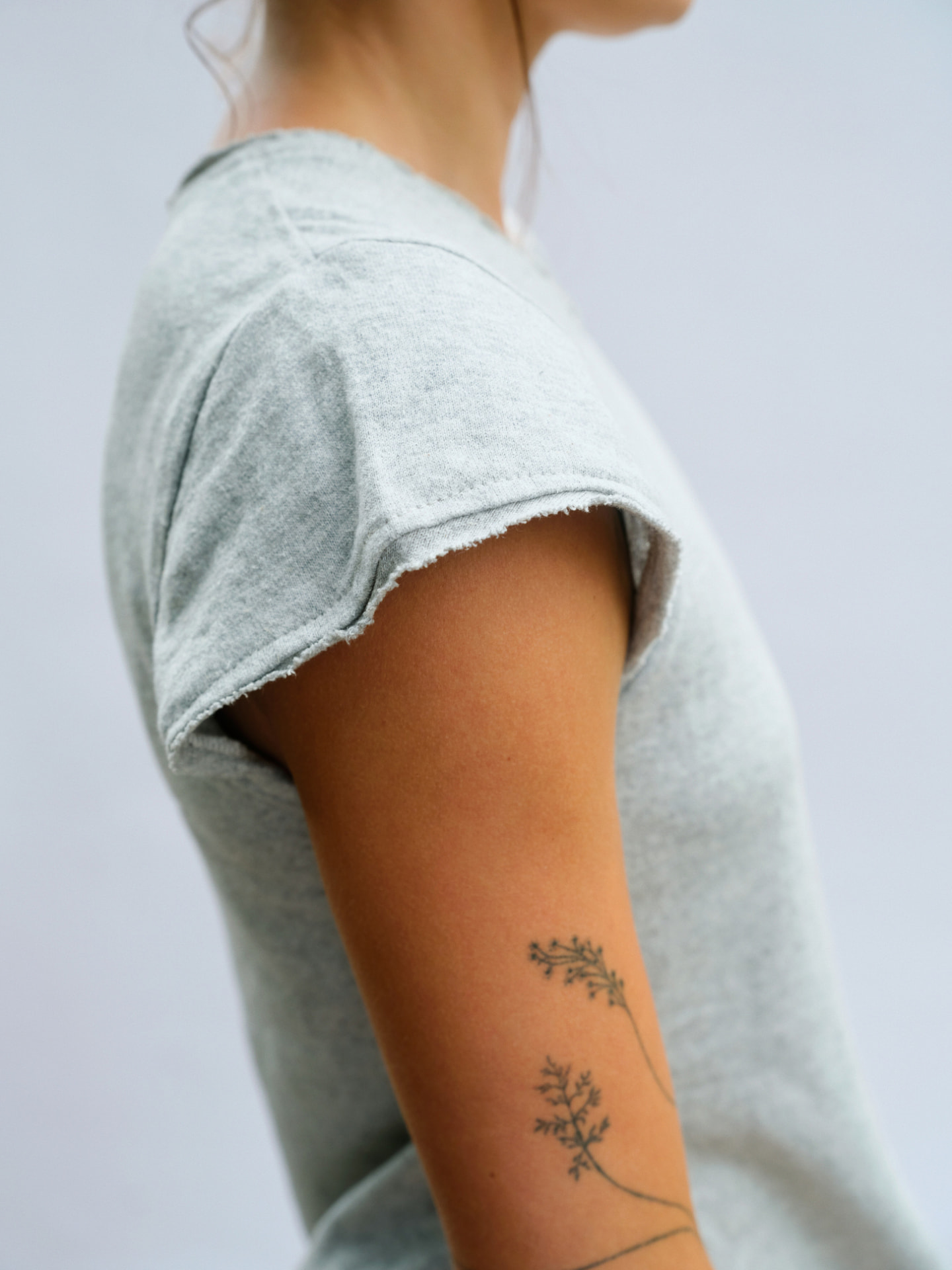 Close view of the Truth-T capped short sleeve and raw-edge hem