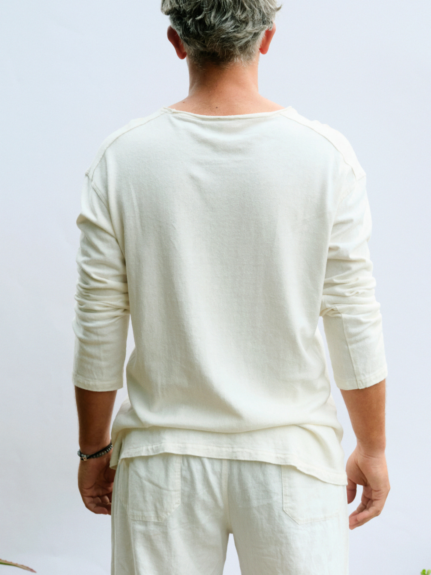 Back view of the masculine long sleeve David showing the raw-finish neckline binding